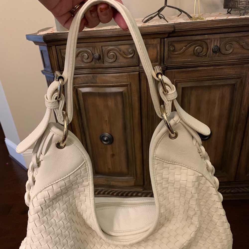 Cache white shoulder bag.